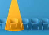 Yellow chair standing out from the crowd. Business concept. 3D rendering