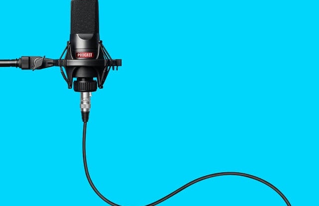 podcast microphone against a blue background