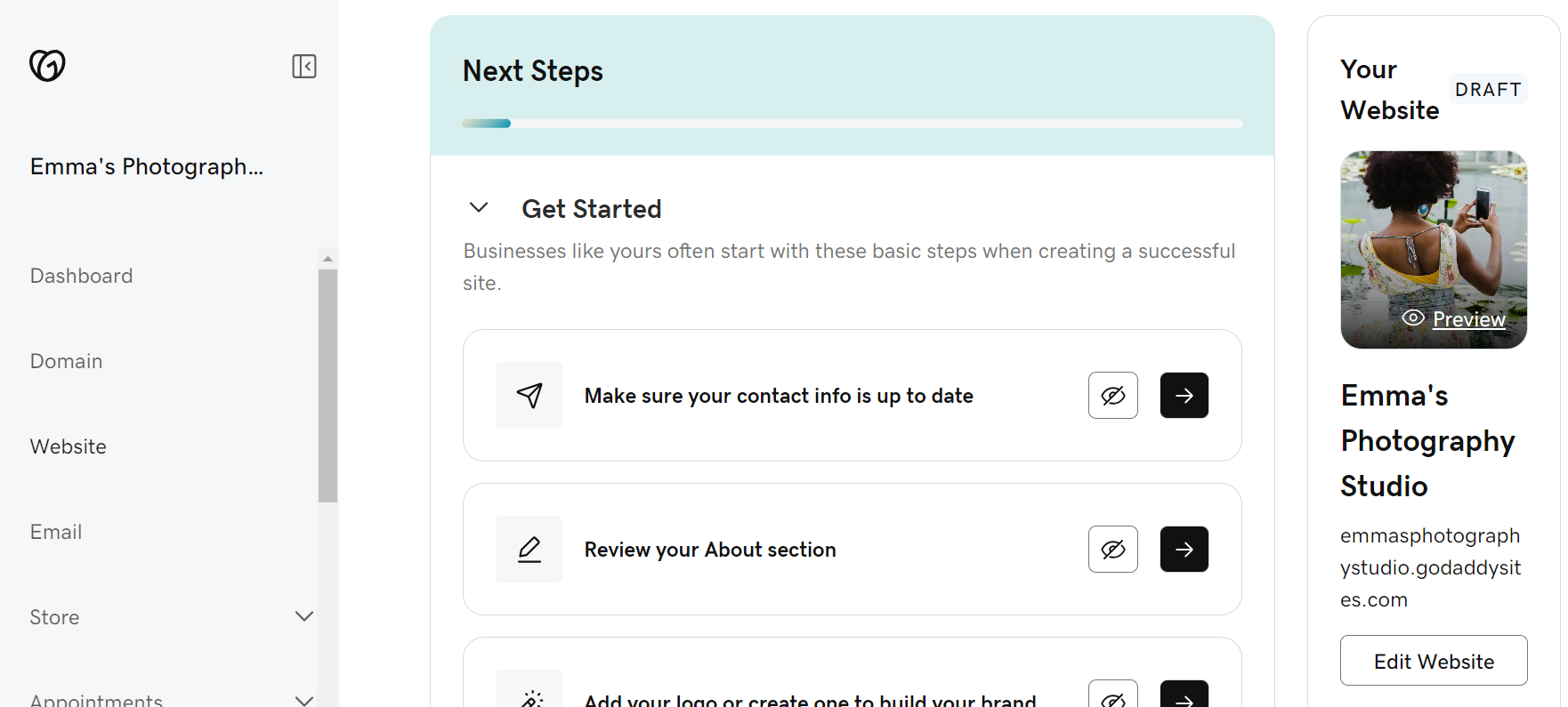 GoDaddy's website builder backend showing onboarding steps